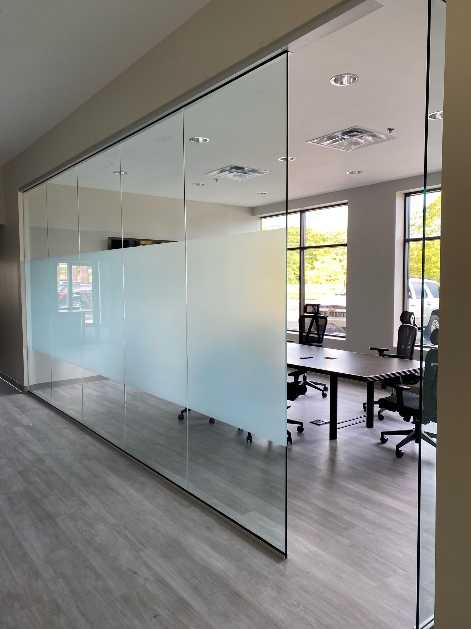 Glass office walls with frosted finish