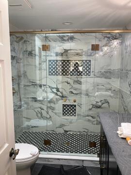 Gold flamed custom glass shower doors installed by Great Lakes Glass in Cleveland, Ohio