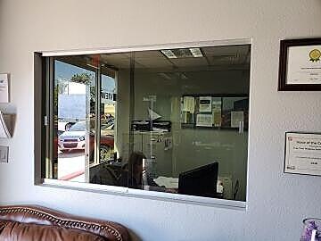 Sliding pass through glass windows for office, installed by Great Lakes Glass in Cleveland, Ohio