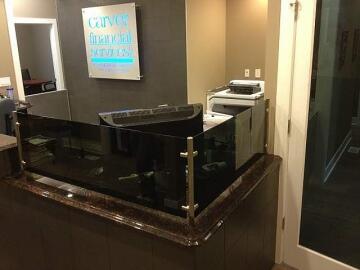 Dark tinted glass divider for office reception by Great Lakes Glass