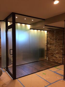Black framed custom glass enclosure for wine room, installed by Great Lakes Glass in Cleveland, Ohio